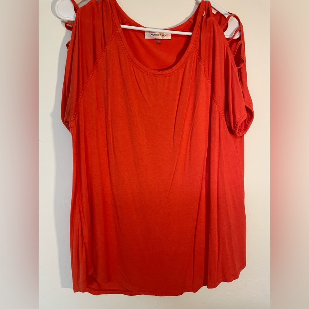 Red/orange top with arm/shoulder cut outs